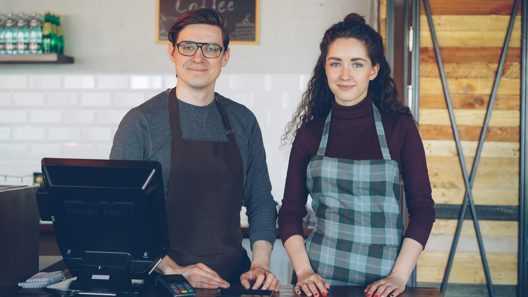 Tom and Ffion standing behind the counter before opening